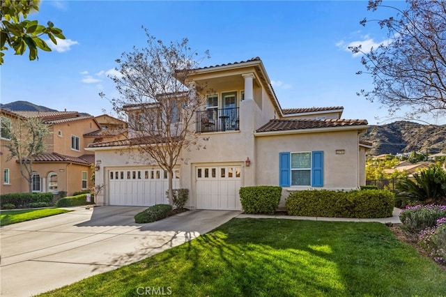 23757 Cahuilla Ct, Corona, CA 92883 - mediterranean / spanish house featuring a balcony, stucco siding, concrete driveway, a tile roof, and a front lawn