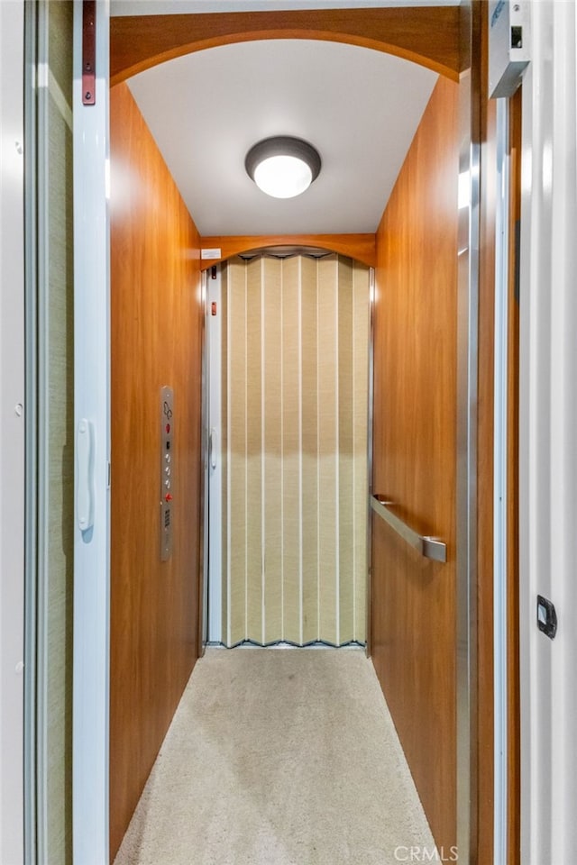 23757 Cahuilla Ct, Corona, CA 92883 - elevator featuring arched walkways and carpet flooring