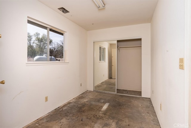 51674 Rd 426, Oakhurst, CA 93644 - unfurnished bedroom featuring unfinished concrete floors and a closet