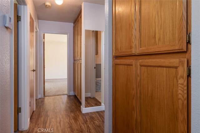 51674 Rd 426, Oakhurst, CA 93644 - hallway featuring baseboards and wood finished floors