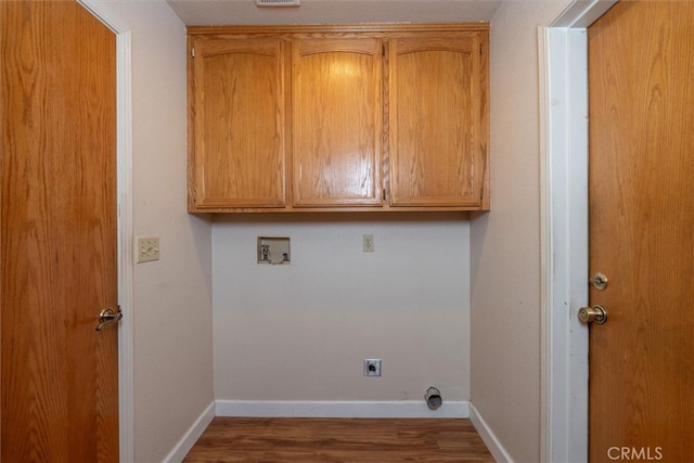 51674 Rd 426, Oakhurst, CA 93644 - laundry area featuring hookup for a washing machine, baseboards, cabinet space, electric dryer hookup, and wood finished floors