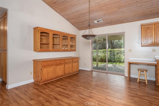 51674 Rd 426, Oakhurst, CA 93644 - unfurnished dining area featuring baseboards, visible vents, wood finished floors, and lofted ceiling