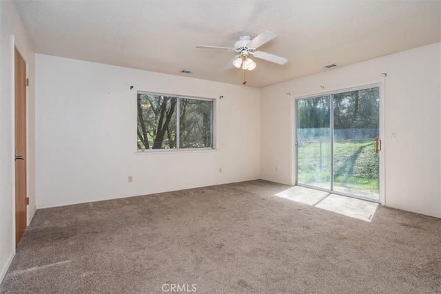 51674 Rd 426, Oakhurst, CA 93644 - carpeted spare room with a textured ceiling, ceiling fan, and visible vents