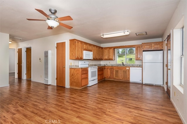 51674 Rd 426, Oakhurst, CA 93644 - kitchen with light countertops, a sink, a ceiling fan, wood finished floors, and white appliances