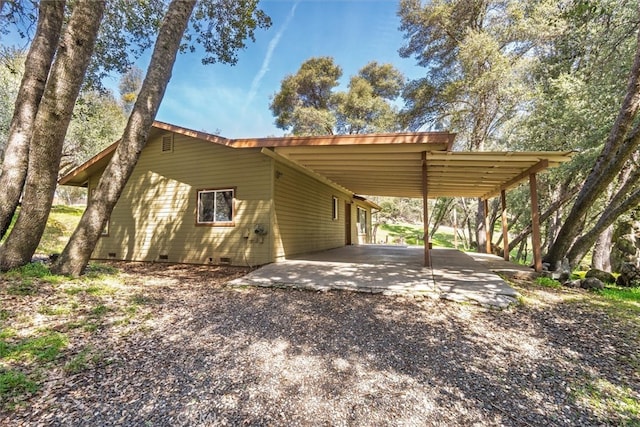 51674 Rd 426, Oakhurst, CA 93644 - view of side of property with driveway, an attached carport, and crawl space