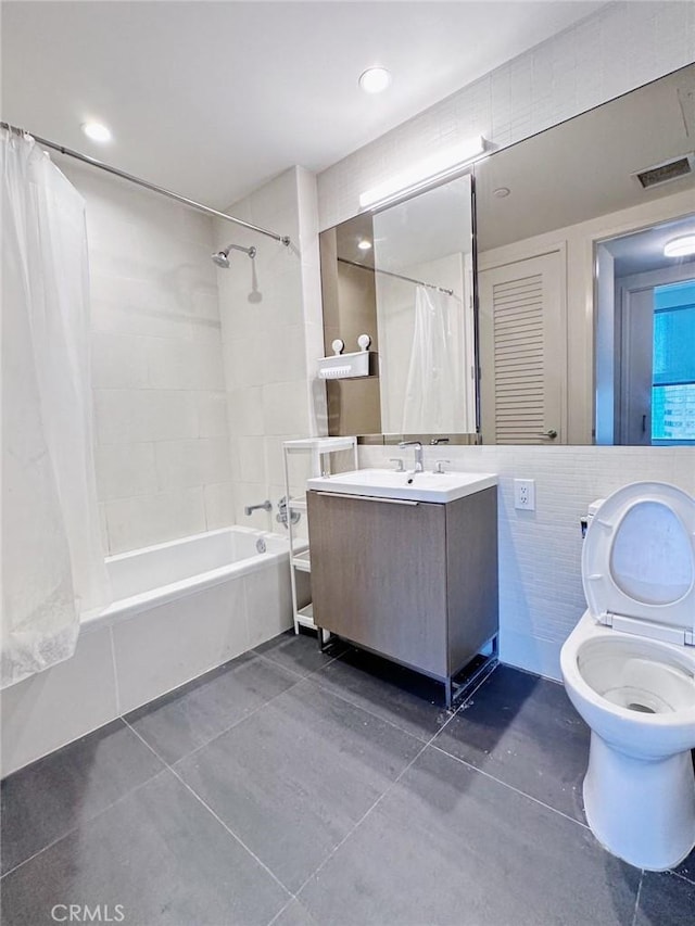 889 Francisco St Unit 2505, Los Angeles, CA 90017 - bathroom featuring shower / bath combo, tile patterned flooring, toilet, vanity, and tile walls