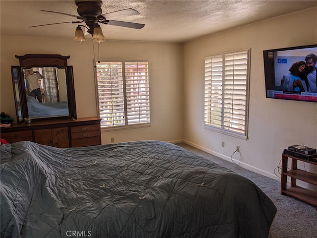 8802 Rubidoux Ave, Yucca Valley, CA 92284 - carpeted bedroom with a textured ceiling and a ceiling fan