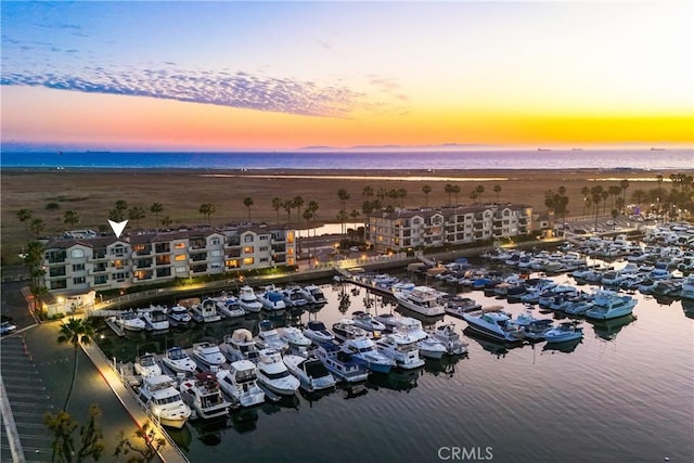 aerial view at dusk with a water view