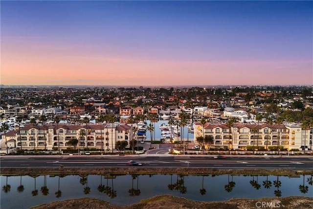 aerial view at dusk with a water view