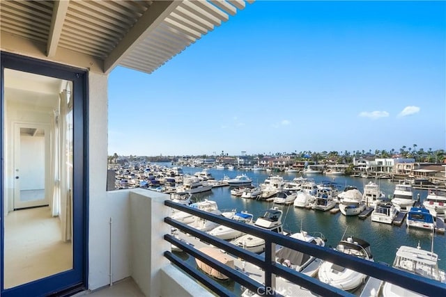 balcony featuring a water view