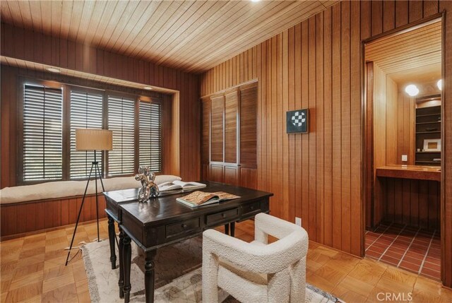 office space featuring wooden ceiling and wood walls