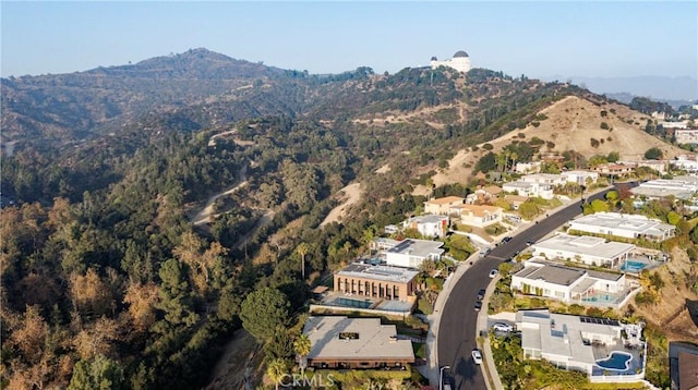 birds eye view of property with a mountain view