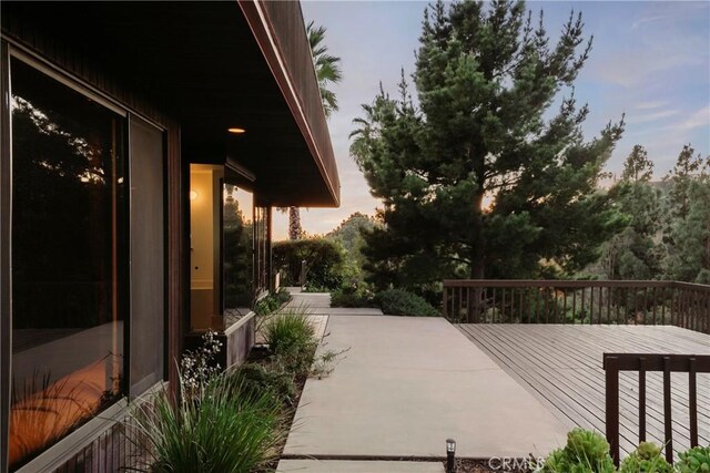 patio terrace at dusk with a deck