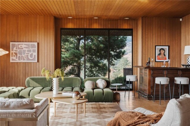 interior space featuring wooden walls and wooden ceiling