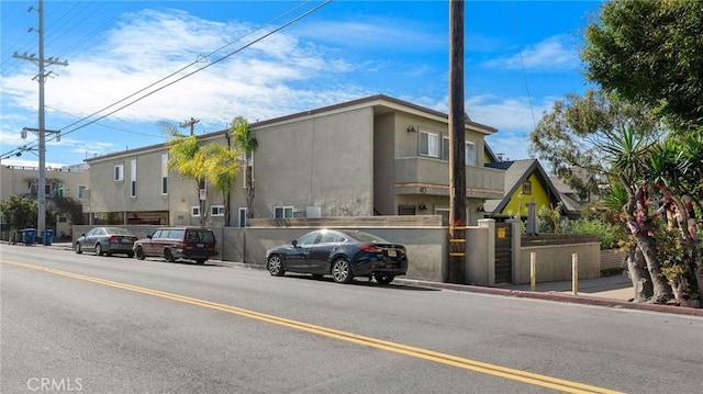 view of building exterior featuring a fenced front yard