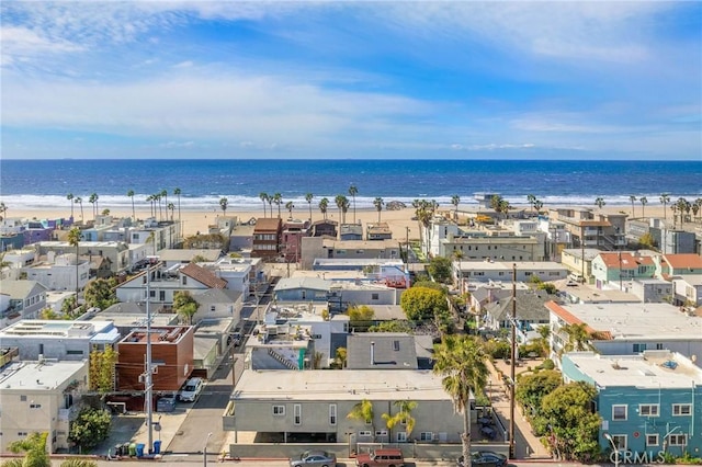 aerial view with a water view and a view of the beach