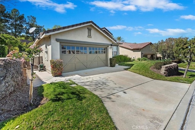 ranch-style house featuring a front lawn, driveway, stucco siding, and a garage