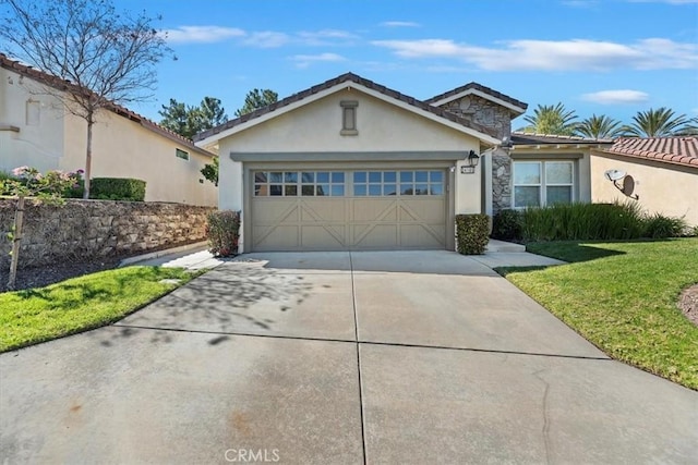 single story home with concrete driveway, stucco siding, an attached garage, stone siding, and a front yard