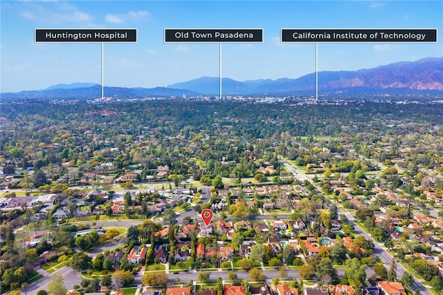 birds eye view of property with a mountain view