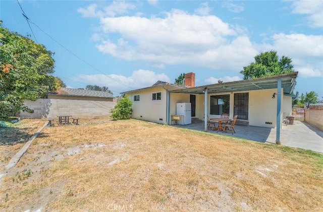 13526 Dunton Dr, Whittier, CA 90605 - back of house with a patio, stucco siding, and a chimney