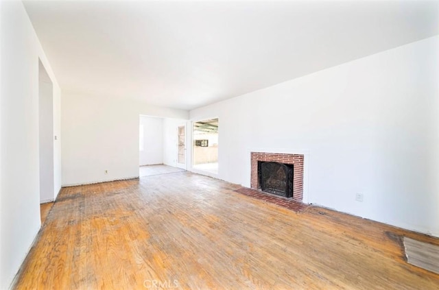 13526 Dunton Dr, Whittier, CA 90605 - unfurnished living room with wood finished floors and a fireplace