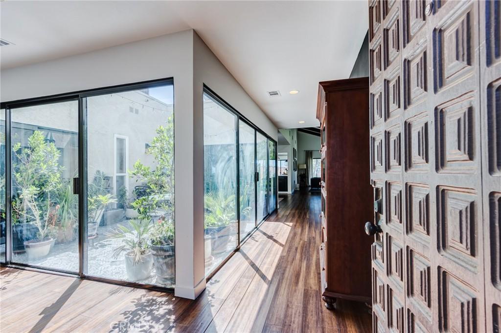 interior space featuring visible vents, recessed lighting, and wood finished floors