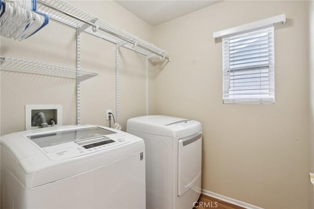 42042 Chestnut Dr, Temecula, CA 92591 - clothes washing area featuring washing machine and clothes dryer, baseboards, and laundry area