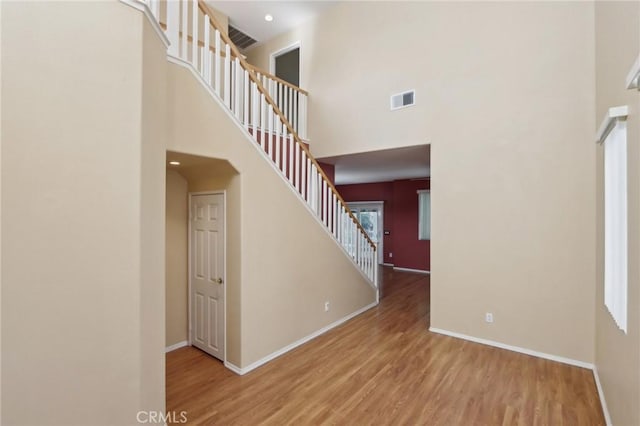 42042 Chestnut Dr, Temecula, CA 92591 - interior space featuring baseboards, visible vents, a high ceiling, and wood finished floors
