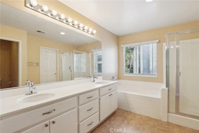 42042 Chestnut Dr, Temecula, CA 92591 - bathroom featuring a garden tub, tile patterned flooring, a shower stall, and a sink