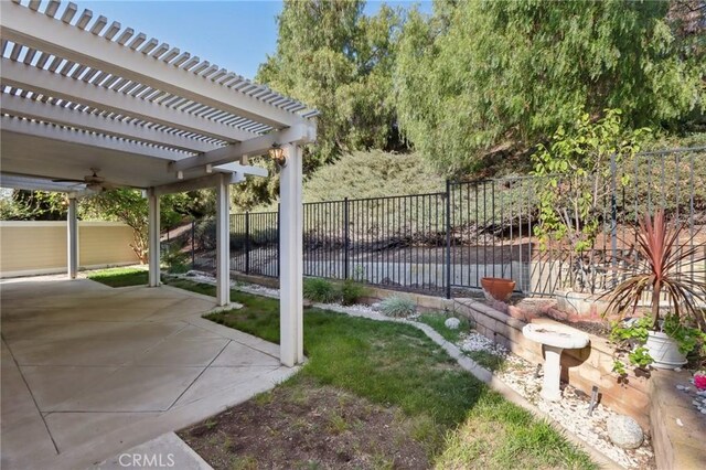 42042 Chestnut Dr, Temecula, CA 92591 - view of yard featuring a fenced backyard, a pergola, and a patio