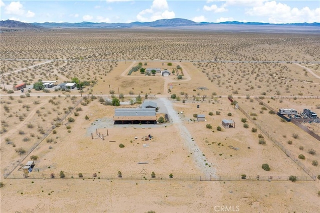 aerial view featuring a mountain view, a rural view, and view of desert