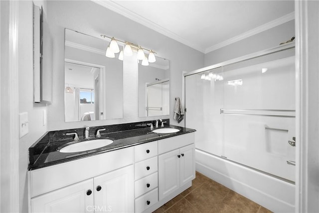 bathroom featuring tile patterned floors, double vanity, ornamental molding, and a sink