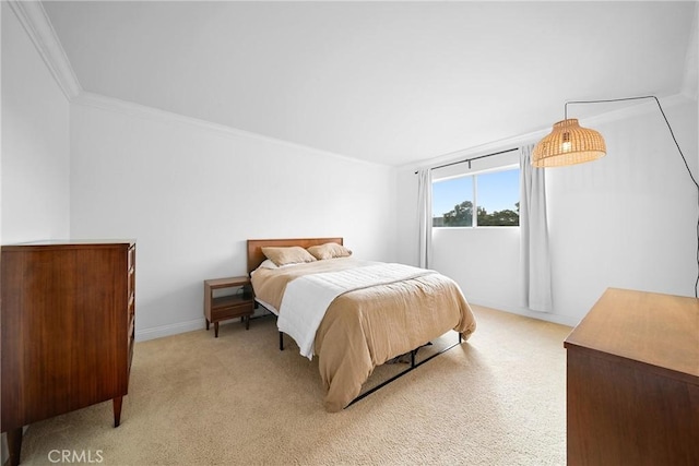 bedroom featuring ornamental molding and light colored carpet