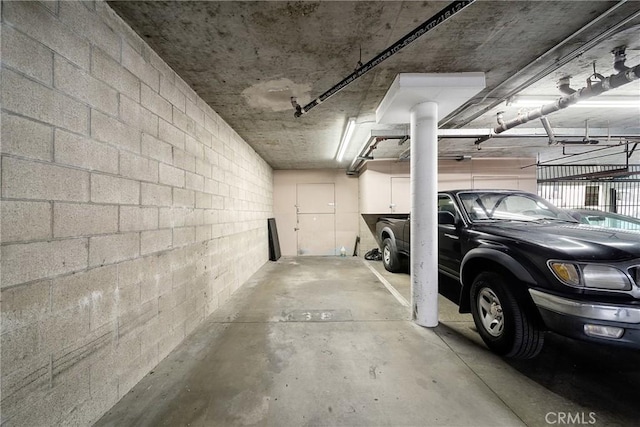 parking deck featuring concrete block wall