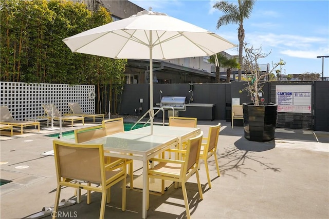 4215 Glencoe Ave Unit 407, Marina Del Rey, CA 90292 - view of patio featuring outdoor dining area and fence