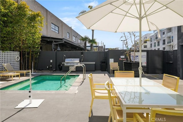4215 Glencoe Ave Unit 407, Marina Del Rey, CA 90292 - view of pool with a fenced backyard, outdoor dining space, a grill, and a patio