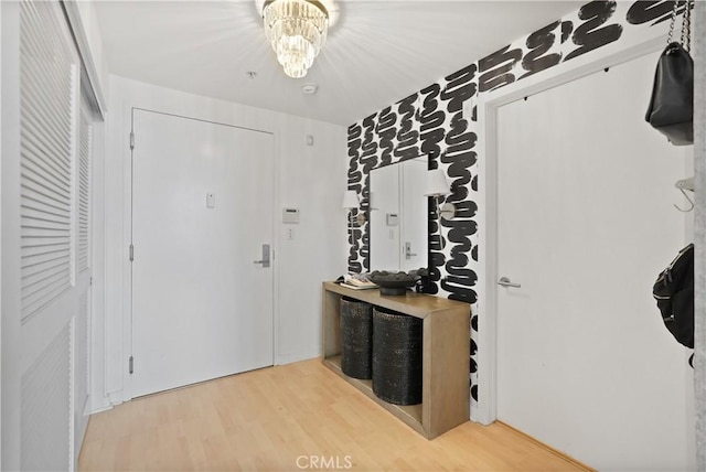 4215 Glencoe Ave Unit 407, Marina Del Rey, CA 90292 - foyer featuring an inviting chandelier and light wood-style floors
