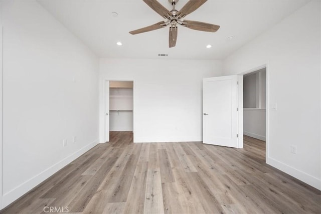 364 S Halcyon Rd, Arroyo Grande, CA 93420 - unfurnished bedroom with light wood finished floors, baseboards, recessed lighting, a walk in closet, and a ceiling fan