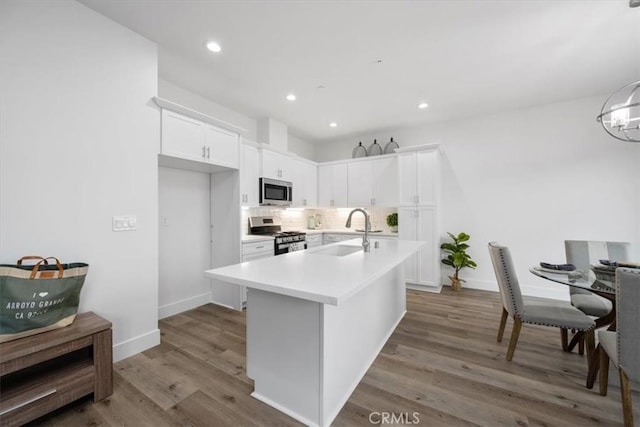 364 S Halcyon Rd, Arroyo Grande, CA 93420 - kitchen with a sink, stainless steel appliances, white cabinets, light countertops, and backsplash