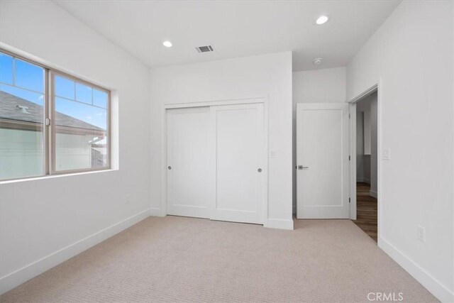 364 S Halcyon Rd, Arroyo Grande, CA 93420 - unfurnished bedroom featuring light carpet, baseboards, a closet, and recessed lighting
