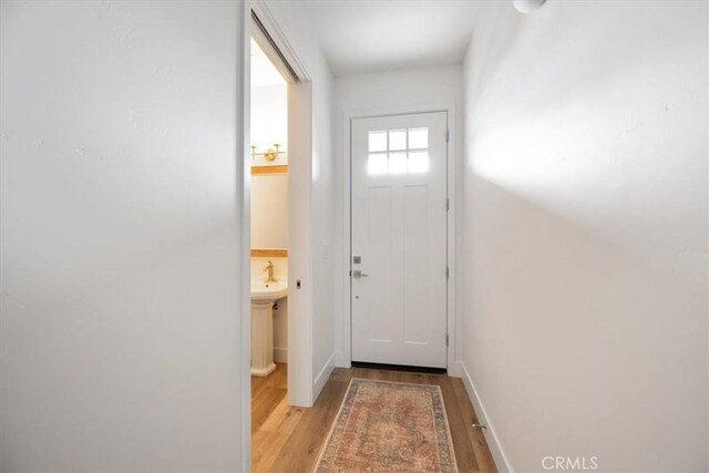 364 S Halcyon Rd, Arroyo Grande, CA 93420 - doorway featuring light wood-type flooring and baseboards