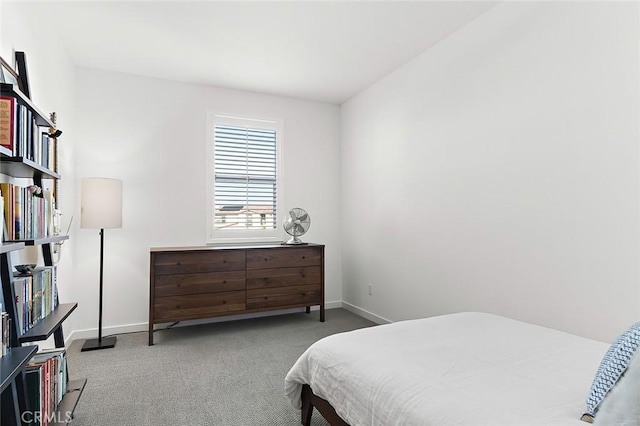 bedroom featuring carpet floors and baseboards