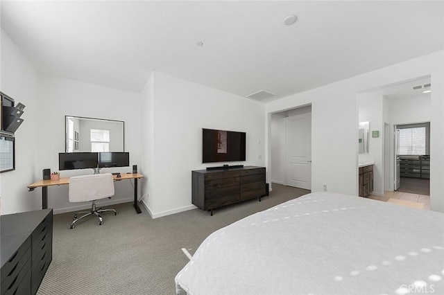 bedroom with light colored carpet, baseboards, connected bathroom, and visible vents