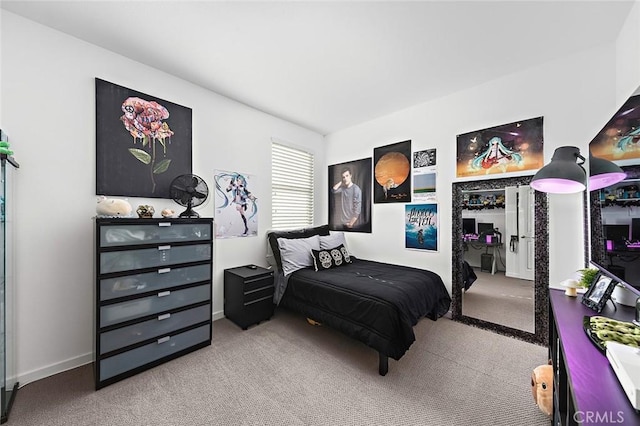 bedroom with baseboards and carpet flooring