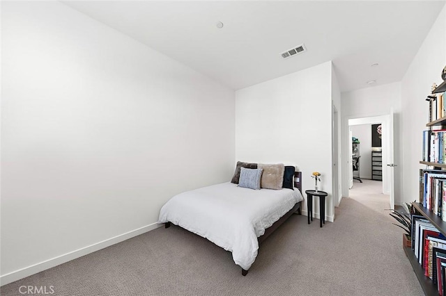 bedroom featuring light colored carpet, baseboards, and visible vents