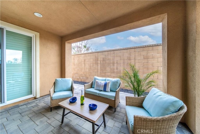 view of patio featuring fence and outdoor lounge area