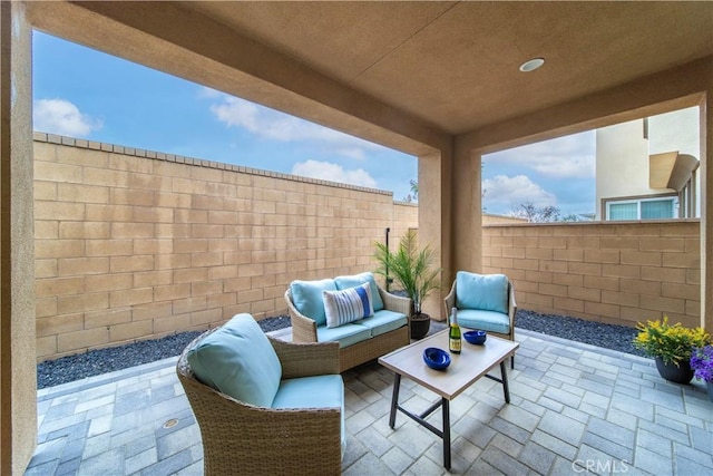view of patio / terrace featuring outdoor lounge area and a fenced backyard