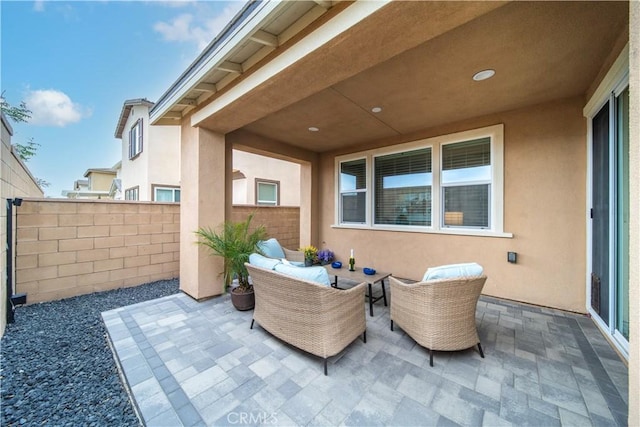 view of patio / terrace with fence and an outdoor hangout area