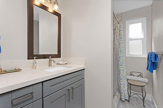 3685 Vista Campana N Unit 72, Oceanside, CA 92057 - bathroom with a shower with curtain, vanity, and baseboards
