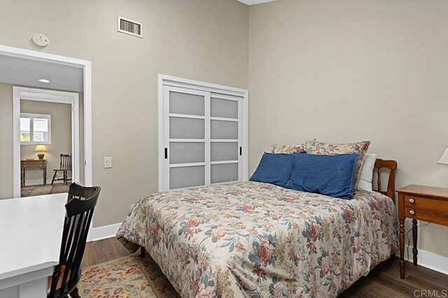 3685 Vista Campana N Unit 72, Oceanside, CA 92057 - bedroom featuring baseboards and wood finished floors